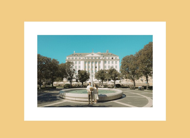 A large building with columns, a fountain, and trees in a square. 4