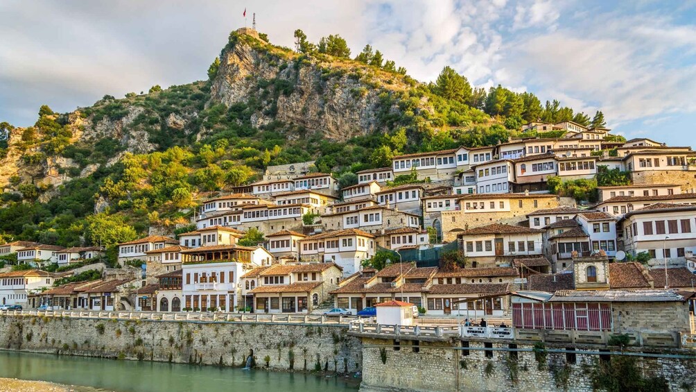 A coastal village with terraced houses built on a hillside overlooking the sea. 1