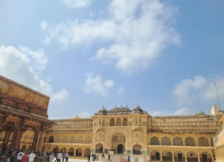 A historic building with intricate architecture and a courtyard. 4