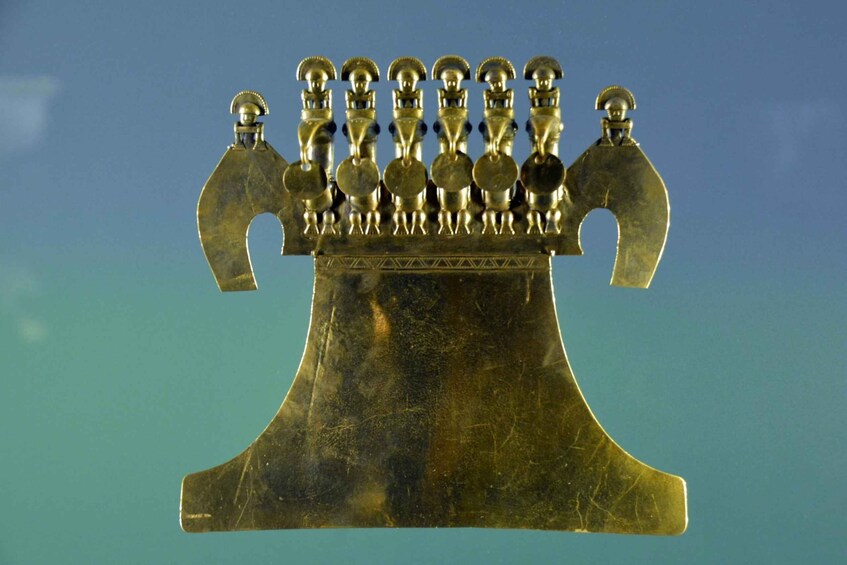 A brass menorah with eight branches and a central holder, set against a blue background. 5