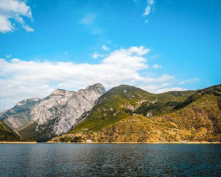 A mountain range with a lake in the foreground. 3