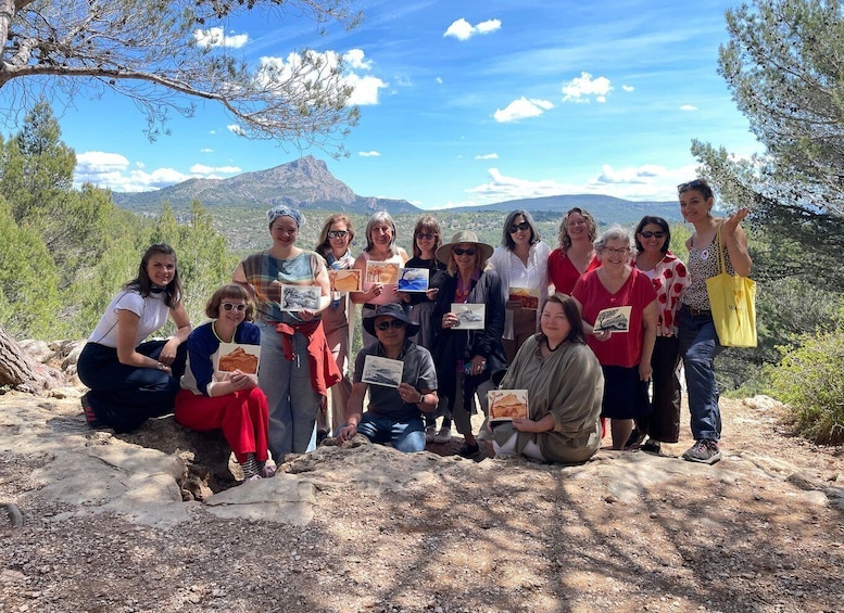 A group of people outdoors with a mountainous landscape in the background. 1
