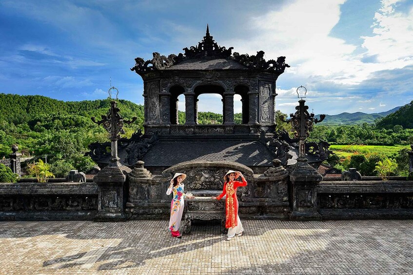 A traditional Balinese temple with intricate carvings and a lush green landscape in the background. 5