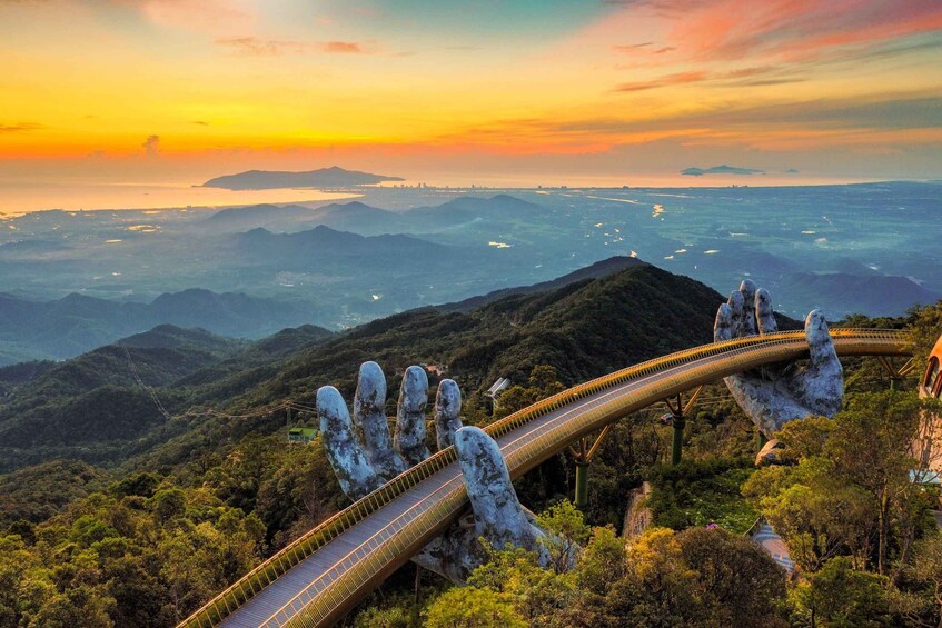 A scenic mountain landscape with a unique bridge structure. 1