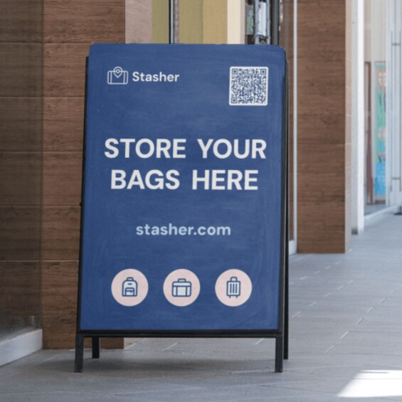 A blue sign with white text and QR code advertising a bag storage service. 2