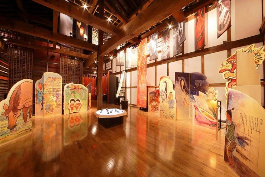 A wooden interior with traditional Asian artwork and calligraphy. 2