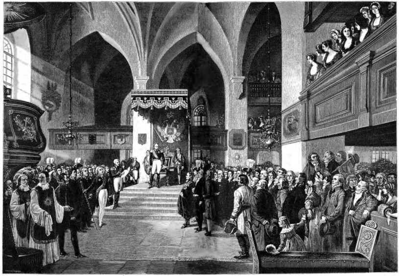 A historical building interior with arched ceilings, a central altar, and a crowd of people. 2
