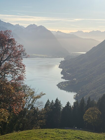 A lake surrounded by mountains with autumn foliage. 3