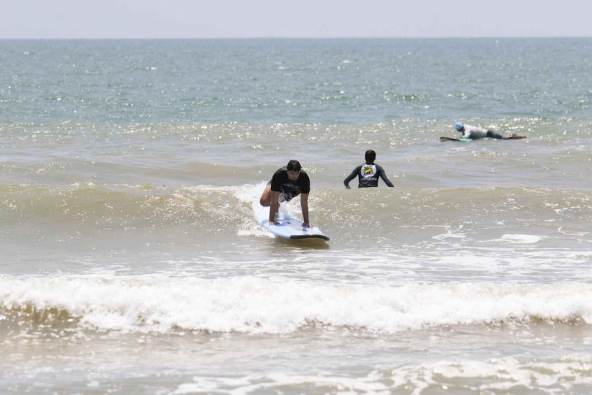 A person surfing on a wave in the ocean. 5