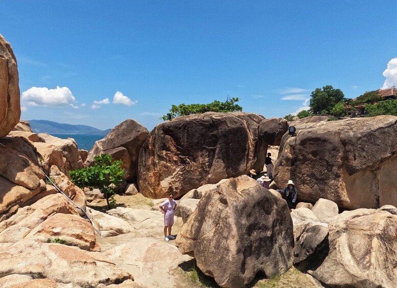 A rocky landscape with large boulders and a clear blue sky. 2