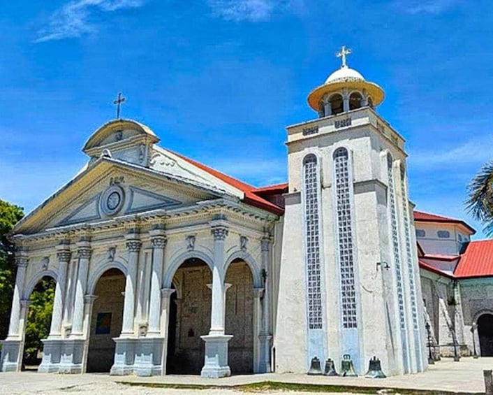 A church with a bell tower and a dome. 1