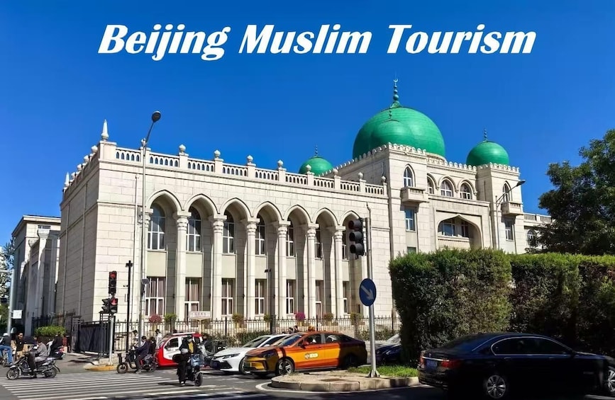 A mosque with green domes and arched windows. 1