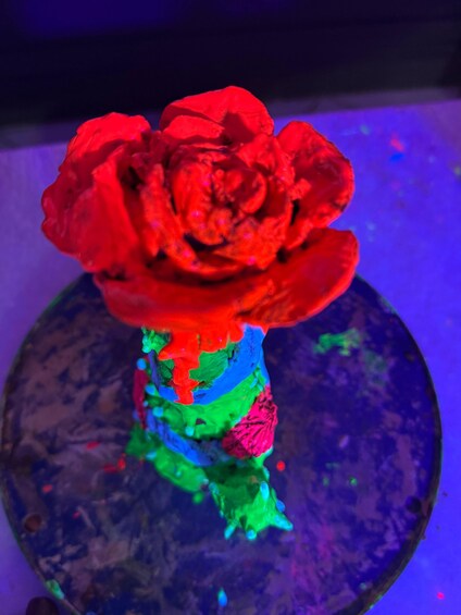 A red rose with a multicolored stem. 5