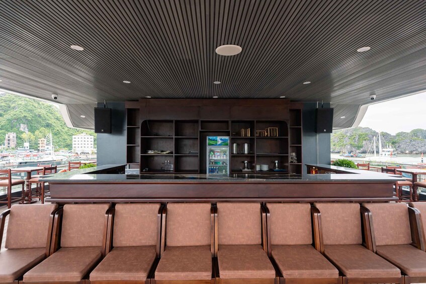 A modern bar with a view of a harbor. 3
