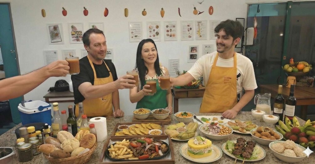 Three people toasting with drinks in a kitchen filled with various dishes and food items. 1