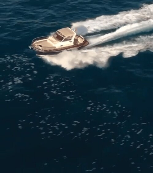 A boat speeding across the water, creating a wake behind it. 5