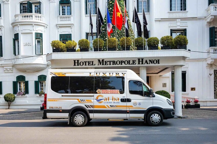 A luxury van parked in front of Hotel Metropole Hanoi. 1