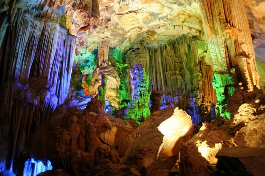 A cave with colorful stalactites and stalagmites. 3