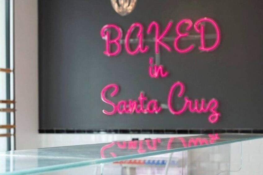 A neon sign that reads "BAKED in Santa Cruz". 5