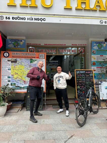 A storefront with a sign reading 'VIETNAM VENTURE' and a map of Vietnam. 2