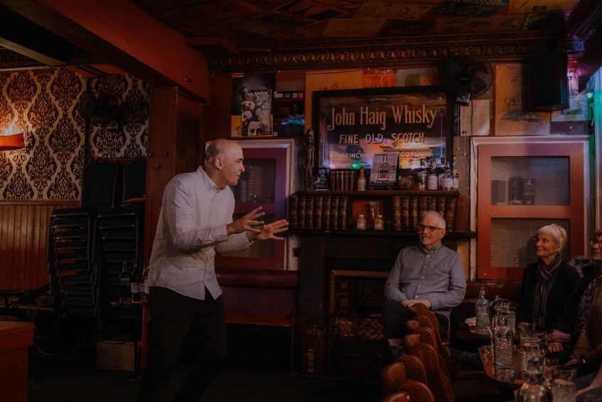 A bar with wooden decor and a sign for John Haig Whisky. 2