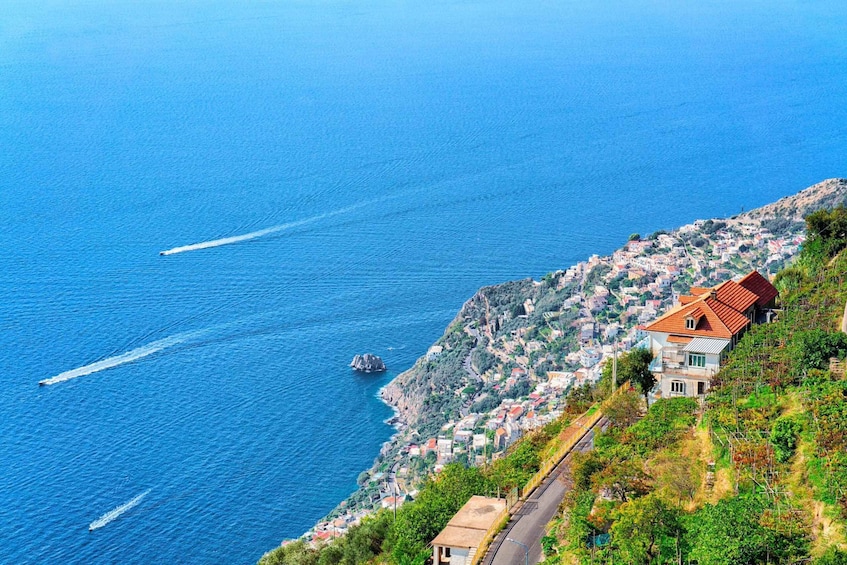 A coastal village with houses on a hillside overlooking the sea. 3