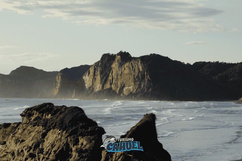 A coastal landscape with rocky outcrops and cliffs. 2