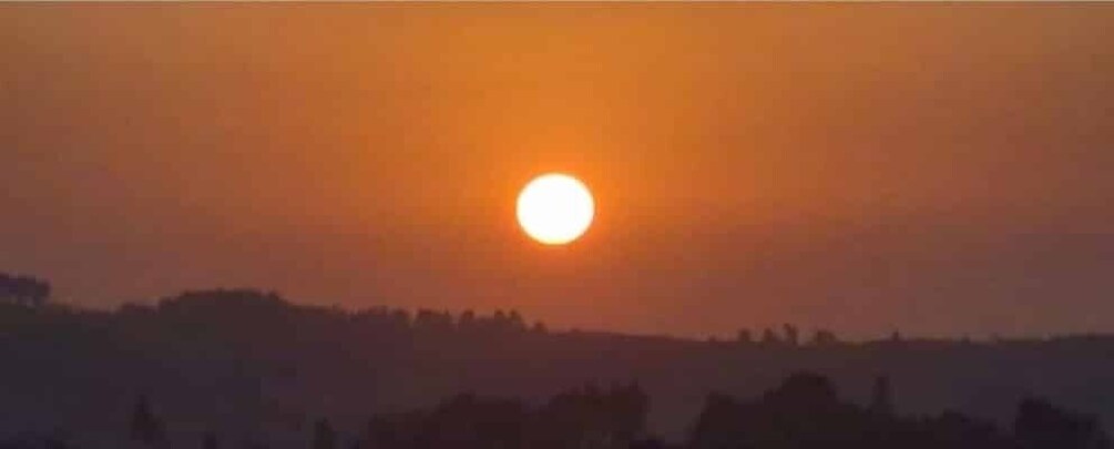 A sunset with the sun low on the horizon. 1