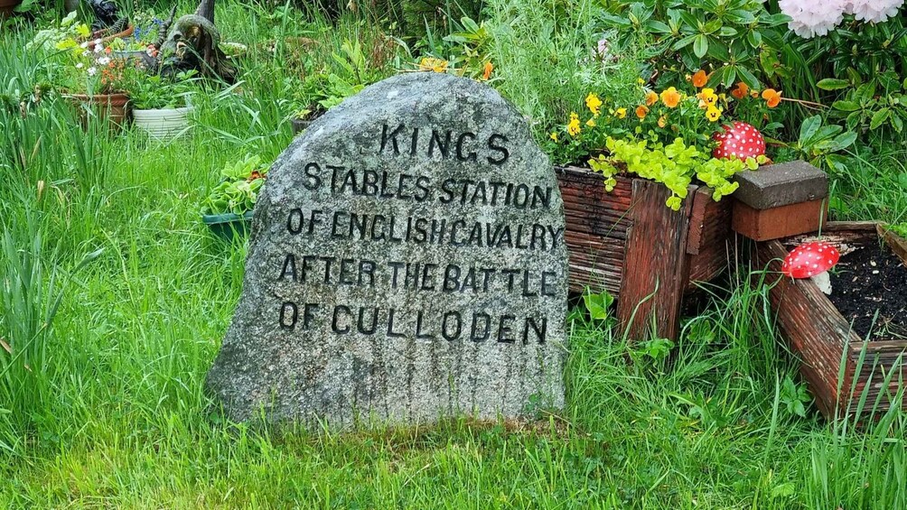 A gravestone with the inscription "Kings Stables Station of English Cavalry after the Battle of Culloden." 3