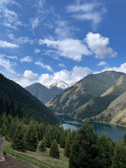 A mountain landscape with a lake and snow-capped peaks. 4