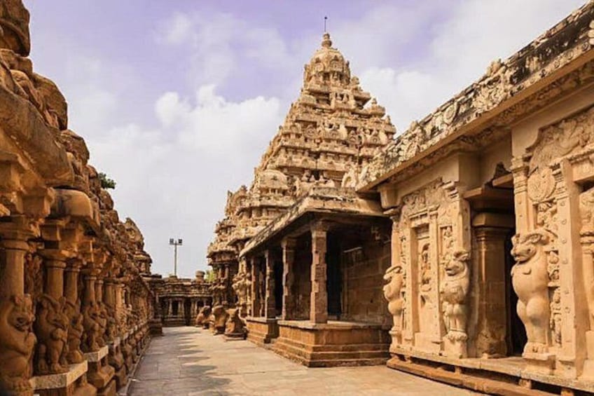 An ancient temple with intricate carvings and a central tower. 5