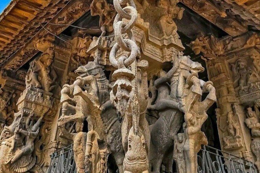 Intricate stone carvings on a temple facade, including figures and mythological creatures. 3