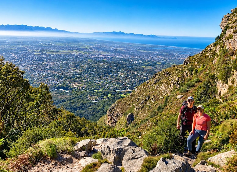 A mountainous landscape with a view of a valley below. 1