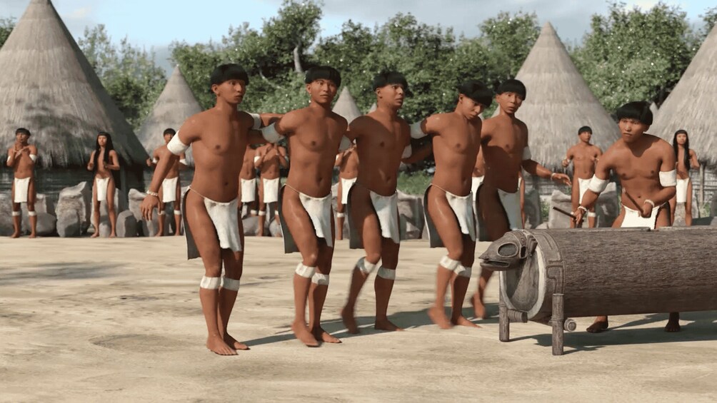 A group of people in traditional attire, standing in a line with thatched-roof huts in the background. 4