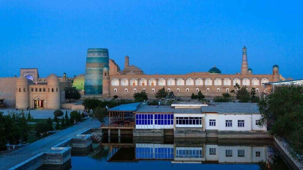 A historic building with a large dome and minarets, surrounded by modern structures. 2