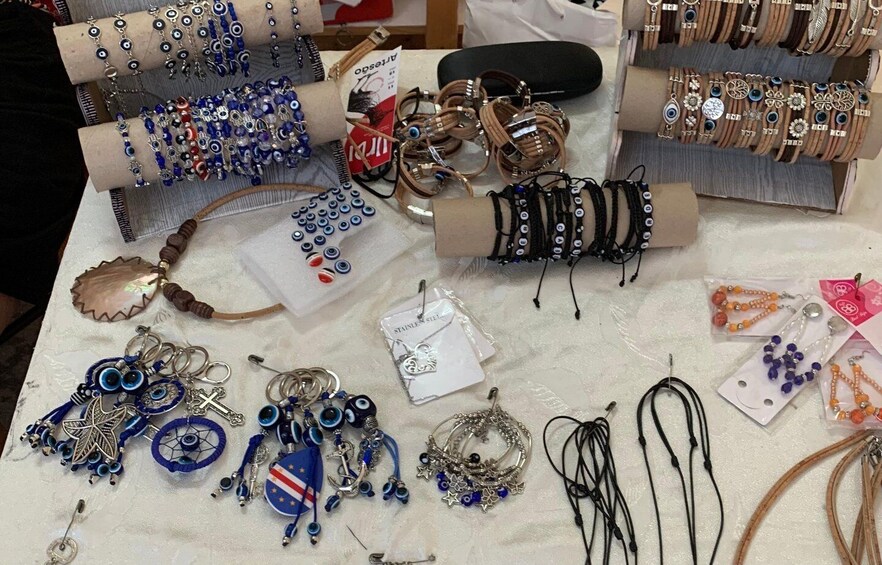 A variety of jewelry items including bracelets, necklaces, and earrings displayed on a table. 3