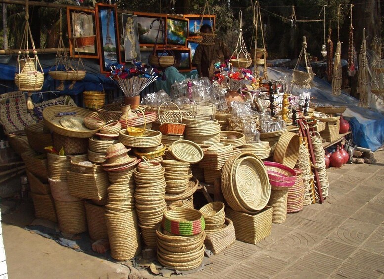 A variety of woven baskets and woven items displayed outdoors. 2