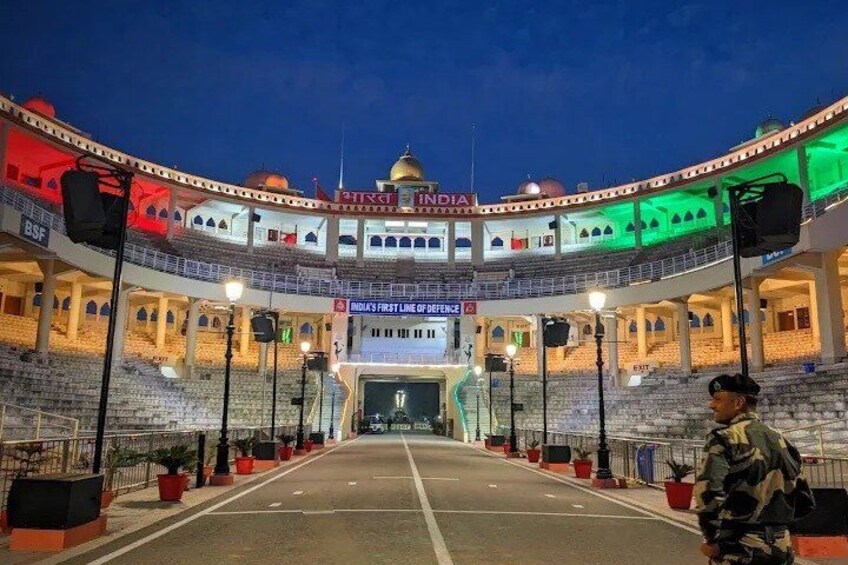An empty theater with a sign reading 'India's First Line of Defence.' 3