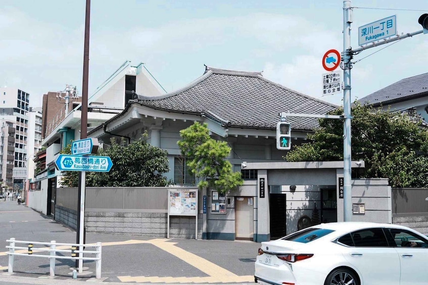 A traditional Japanese building with a sign for Kasei Bashi-dori Ave. 3