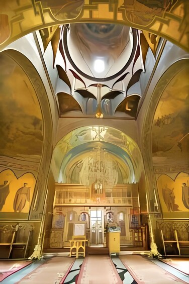 An ornate interior with high ceilings, arched windows, and detailed wall murals. 2