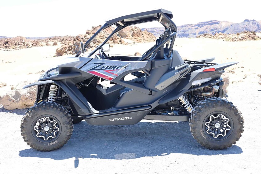 A black and red ATV with 'CFMOTO' branding, large off-road tires, and a rugged design. 1