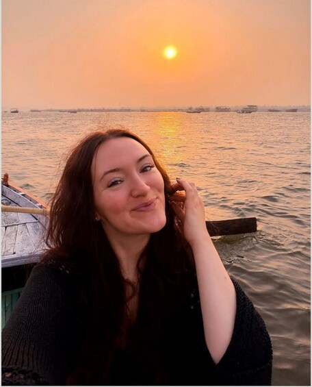 A person near a body of water during sunset. 3