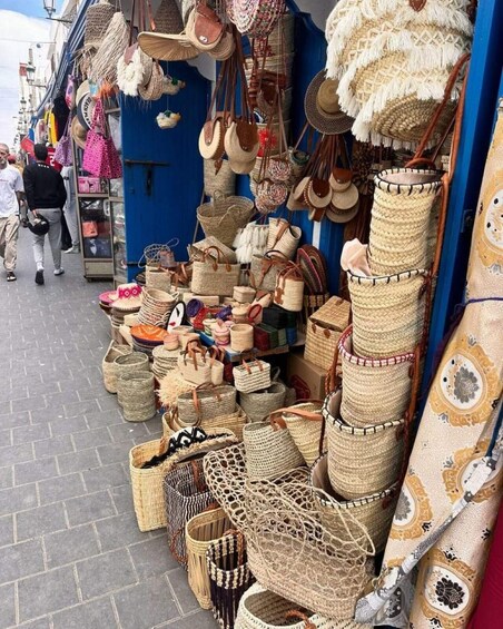 A market stall with various woven baskets and bags. 5