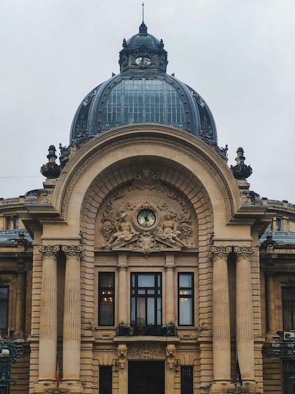A grand building with a large dome and intricate carvings. 4
