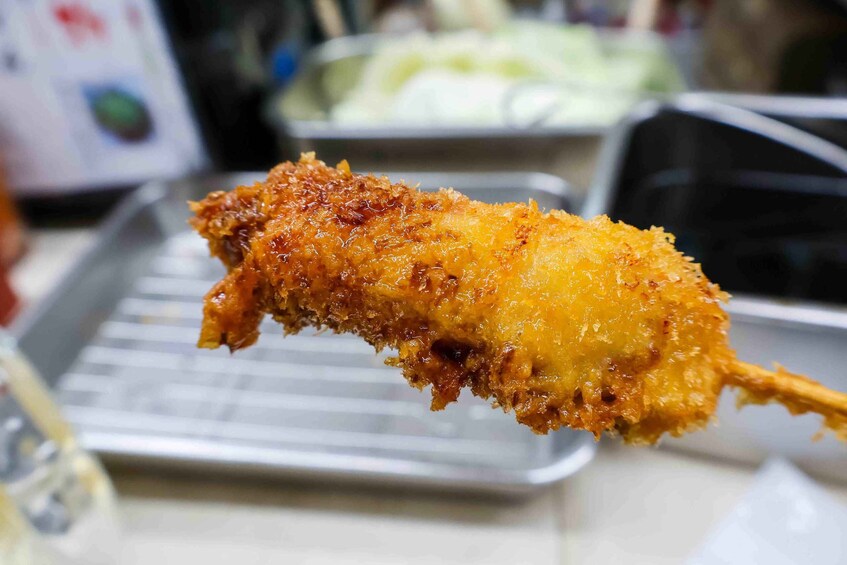 A fried chicken leg with a crispy coating. 3