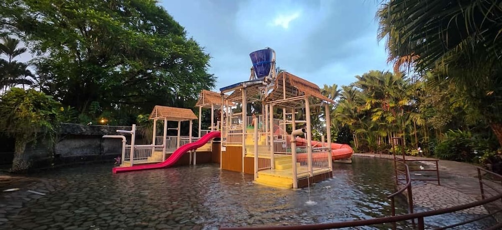 A water play area with slides and a water feature. 1