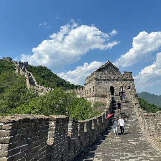The Great Wall of China with tourists walking along it. 1