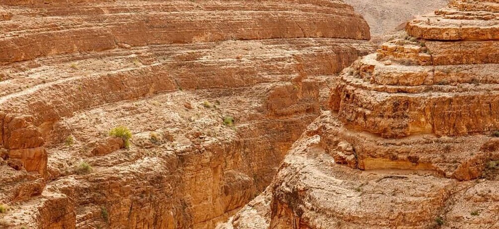 A rugged canyon with layered rock formations. 2