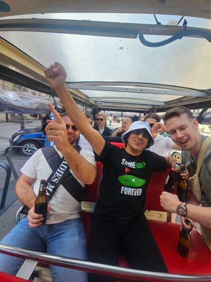 People on a boat with bottles and a banner. 3