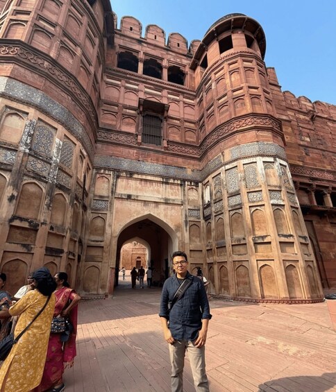 A historic building with intricate carvings and a large archway. 4